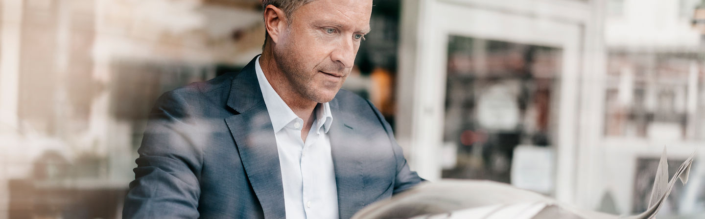 Man Reading Newspaper